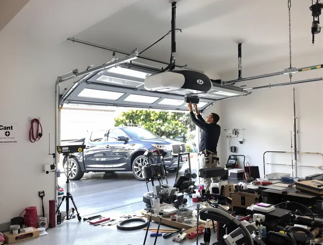 Palm Coast Garage Door Repair specialist installing smart garage door opener system in Palm Coast home