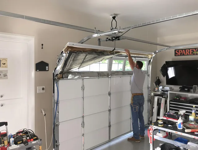 Garage door section replacement by Palm Coast Garage Door Repair in Palm Coast